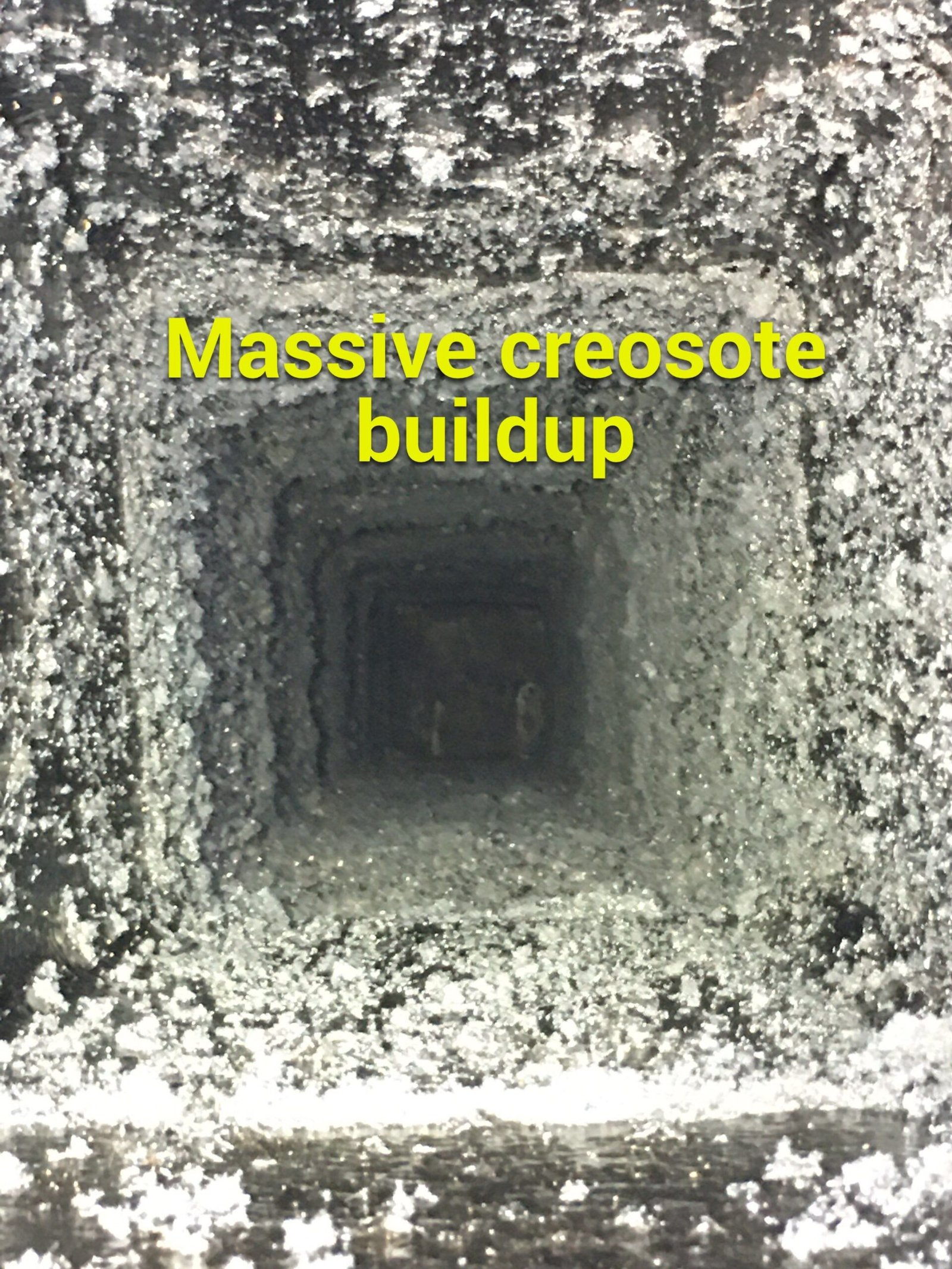 Chimney flue with massive creosote buildup coating every wall